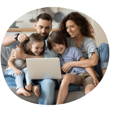 Young family using a laptop together