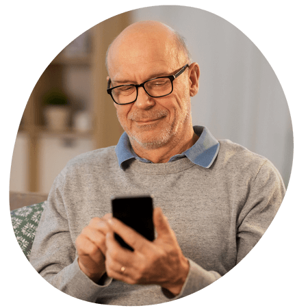 elderly man using his mobile
