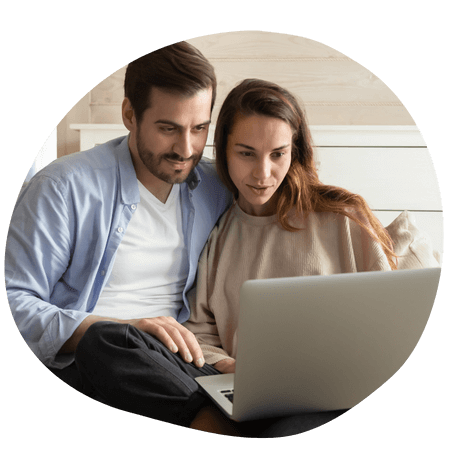 young couple using a laptop together