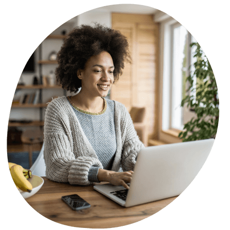 woman working on a laptop in her home