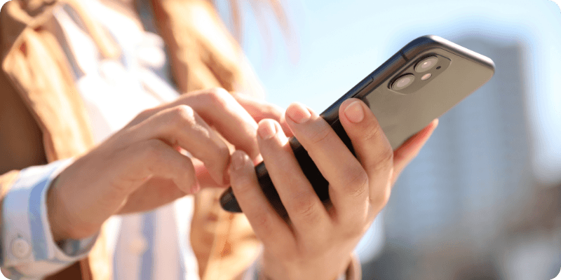 woman restarting her mobile phone