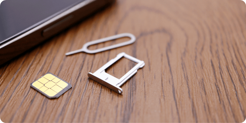 sim tray taken out of phone to inspect SIM