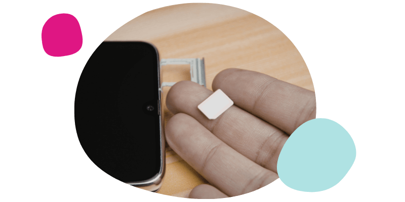 person replacing their SIM card