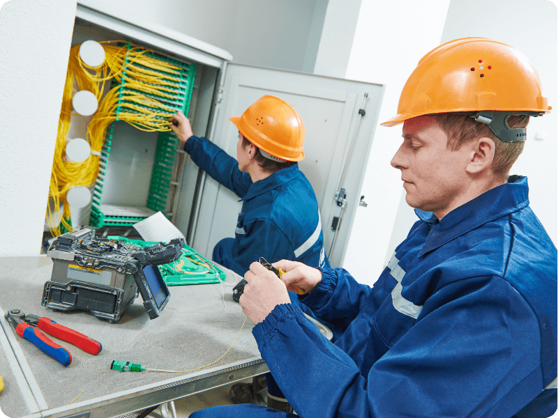 two workers installing broadband lines