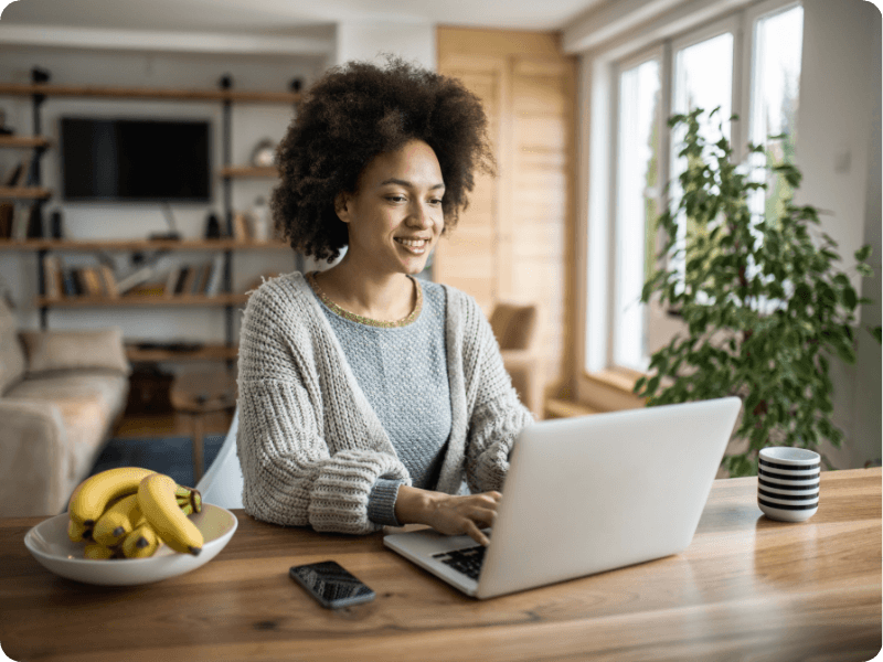 young woman using her laptop at home
