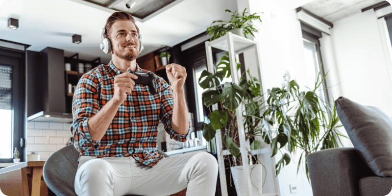 man celebrating whilst gaming