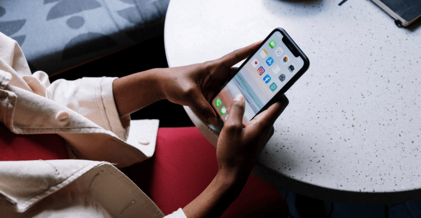 business woman holding an iPhone