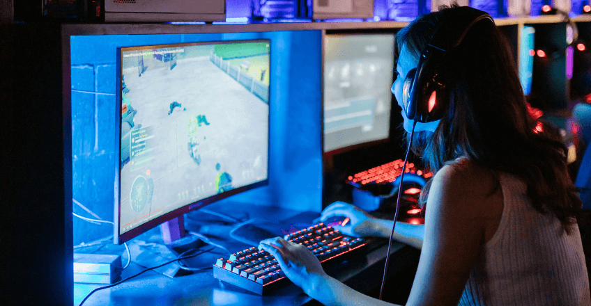 PC Gamers playing at desks with each other