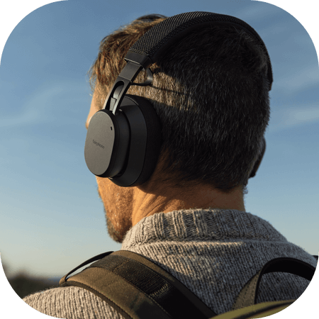 back of mans head wearing Fairbuds XL headphones