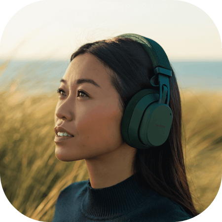 woman wearing black Fairbuds XL headphones