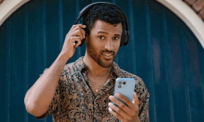 man using his fairphone 5 whilst wearing fairbuds