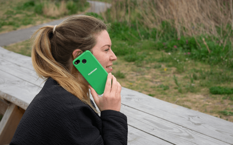 Lady on Fairphone 3 with green case