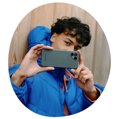 man taking a picture with his Fairphone 4